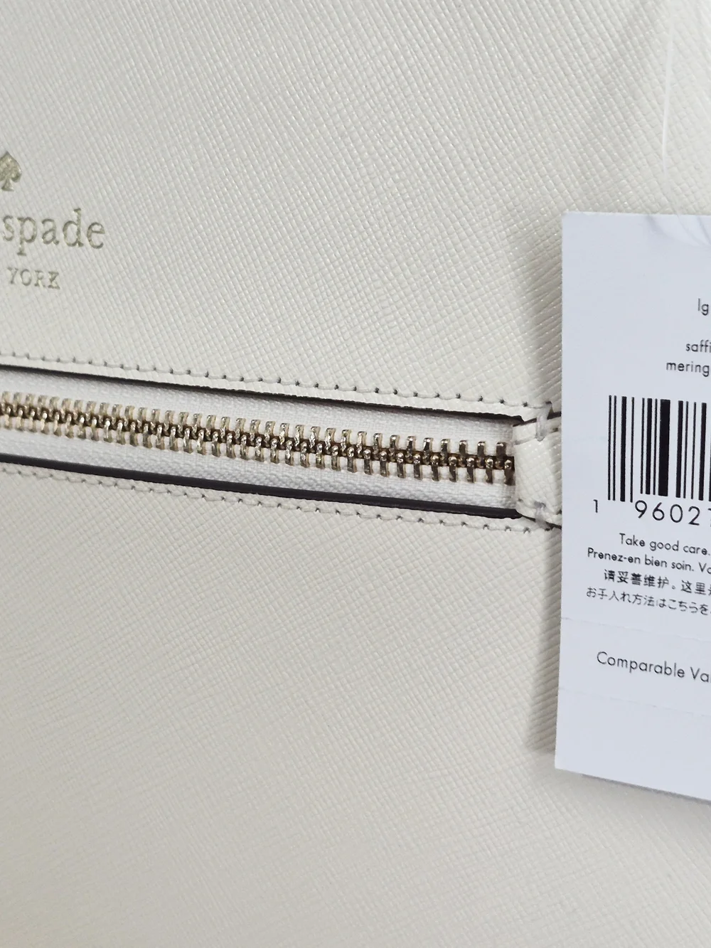 Kate Spade Sadie Cream Saffiano Leather crossbody with front zip